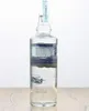 A clear shot of a bottle of Wyborowa vodka against a white background, placed on a wooden surface. Produktbild-Vorschau