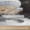 A close-up view of a cleaning device spraying water onto a mop head. Produktbild-Vorschau