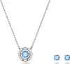 A necklace and a pair of earrings with blue stones and silver settings. Produktbild-Vorschau