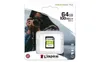 A Kingston SD card in its retail packaging, with a person holding a camera in the background. Náhled obrázku produktu
