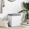 A white storage bench with a gray cushion is placed in an entryway next to a large potted plant and a canvas tote bag. Podgląd zdjęcia produktu