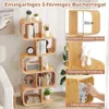 A S-shaped bookshelf filled with books, decorations, and a speaker, shown in a room setting. Podgląd zdjęcia produktu