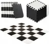A collage of black and white foam play mats, shown stacked, assembled into a cube, and laid out in a checkerboard pattern. Náhled obrázku produktu