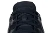 A close-up view of the top of a dark navy blue sneaker. Náhled obrázku produktu