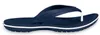 A single navy blue flip-flop with a white stripe on the sole, shown from the side against a white background. Produktbild-Vorschau