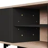 A close-up view of a black and wood TV cabinet, showing the interior shelves and mounting points. Anteprima dell’immagine prodotto