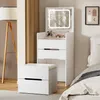 A white vanity table with a lighted mirror and a stool in a bedroom setting. Náhľad obrázku produktu