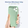 A hand holding a light green phone case against a white background. Produktbild-Vorschau