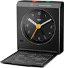 A black Braun alarm clock is shown with its front panel open, revealing a detailed chart on the inside of the panel. Voir les images du produit