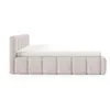 A side view of a beige upholstered bed with a white mattress. Produktbild-Vorschau