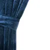 A close-up of a dark blue curtain with a patterned texture, tied back with a fabric band. Voir les images du produit