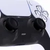 A close-up shot of a white and black PlayStation 5 controller. Produktbild-Vorschau