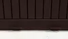 A close-up view of the bottom of a brown storage box, showing its feet resting on a textured surface. Podgląd zdjęcia produktu