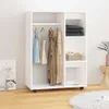 A white wardrobe with clothes hanging inside and shelves with items. Voir les images du produit