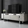 A modern TV stand with a marbled finish and metallic legs, in a dimly lit room. Voir les images du produit