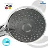 A close-up view of a chrome and gray hand shower head, with small colored rings in the upper left corner. Produktbild-Vorschau
