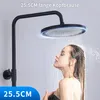 A woman is showering under a black shower head. Podgląd zdjęcia produktu