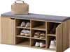 A shoe cabinet with a cushioned top is filled with various shoes and a handbag. Produktbild-Vorschau