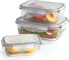 Three glass food storage containers are stacked and arranged in a studio setting against a white background. Voir les images du produit