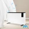 A white electric heater with a black top panel and digital display, shown on a light-colored floor with sheer white curtains to the left. Blue arrows indicate airflow emanating from the heater. Voir les images du produit