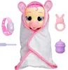 A baby doll wrapped in a white blanket with pink trim, surrounded by accessories. Anteprima dell’immagine prodotto