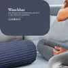 A person is resting on a sofa with a bolster pillow. Podgląd zdjęcia produktu