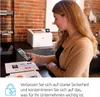A woman is using a smartphone to interact with a printer in an office setting. Podgląd zdjęcia produktu
