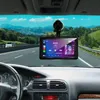 A car's dashboard view with a GPS/media device mounted on the windshield, showing a scenic road and mountains outside. Náhled obrázku produktu