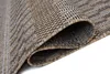 A close-up view of a rolled-up rug, showing its woven texture and pattern. Náhľad obrázku produktu