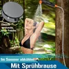 A woman is showering outdoors with a portable camping shower. A round storage bag is shown in the upper left corner. Produktbild-Vorschau