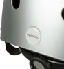Close-up of a silver helmet with a circular logo on the side. Náhled obrázku produktu