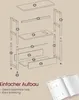 An exploded view diagram showing the assembly of a narrow side table with multiple shelves and a magazine rack. Produktbild-Vorschau
