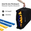 A black bag filled with blue and yellow items, with a person's hand holding the bag's handle. Several blue and yellow bars are shown in the foreground. Náhľad obrázku produktu