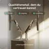 Two monitor arms are mounted on a stand, with monitors attached to each arm. The background is a gradient of gray to white, with soft lighting. Produktbild-Vorschau
