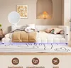 A white upholstered daybed with a beige comforter and pillows, set in a bedroom with a framed artwork and a table lamp. The bed has LED lighting underneath. Produktbild-Vorschau