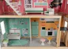 A dollhouse with multiple rooms and furniture, viewed from the front. Náhľad obrázku produktu