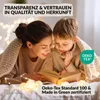 A mother and child are reading a book together under a blanket, surrounded by fairy lights. Produktbild-Vorschau