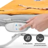 A hand is pressing buttons on a baby bouncer's control panel, which is attached to the underside of the bouncer. The bouncer has a yellow and gray fabric cover. Produktbild-Vorschau