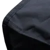 A close-up view of the black fabric of a grill cover, showing the stitching and texture. Produktbild-Vorschau