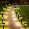 A pathway lined with solar garden lights at dusk. Anteprima dell’immagine prodotto
