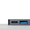A close-up view of a USB-C hub with multiple ports, including a USB-C port and a USB 3.0 port. Produktbild-Vorschau