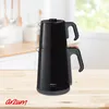 A black electric Turkish tea maker sits on a wooden table in a kitchen setting. Produktbild-Vorschau
