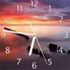 Wallario Design Wanduhr Sandstrand im Sonnenuntergang - Produktbild-Vorschau 1