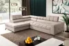 A modern living room with a large sectional sofa, coffee table, and artwork. Náhľad obrázku produktu