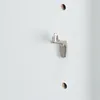 A close-up view of a shelf support peg inserted into a hole on a white surface, likely a cabinet or bookshelf. Produktbild-Vorschau