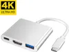 A white USB-C hub adapter with multiple ports, including USB-C, HDMI, and USB-A, is shown against a white background. A yellow and black '4K ULTRA HD' graphic is in the upper left corner. Produktbild-Vorschau
