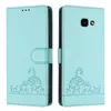 A light green leather flip case for a Samsung Galaxy A5 2017 with a cat design is shown from the front and back. Produktbild-Vorschau