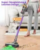 A person is using a cordless vacuum cleaner in a living room, with a cat sitting nearby. Produktbild-Vorschau