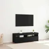 A black TV stand with a TV mounted above it, in a room with a light-colored rug. Náhľad obrázku produktu
