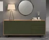 A dresser with a lamp and mirror above. Podgląd zdjęcia produktu